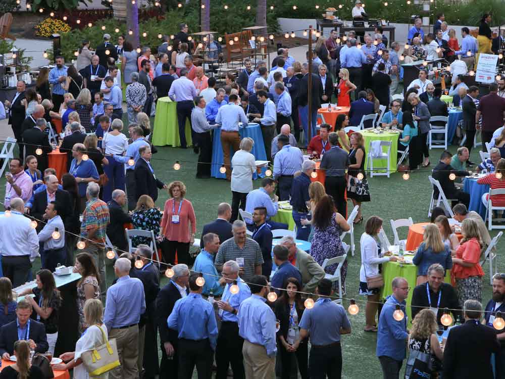 Large group of people networking at SNAC event